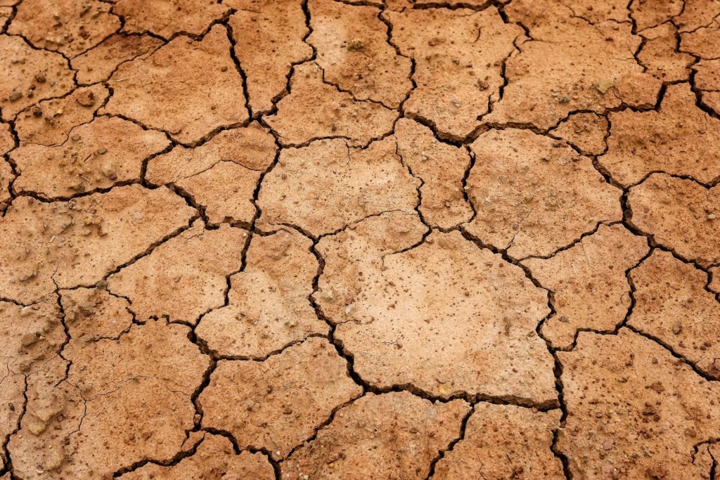 Dried earth representing droughts