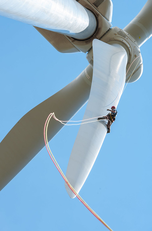 A person performing Wind Turbine maintainance in the UK